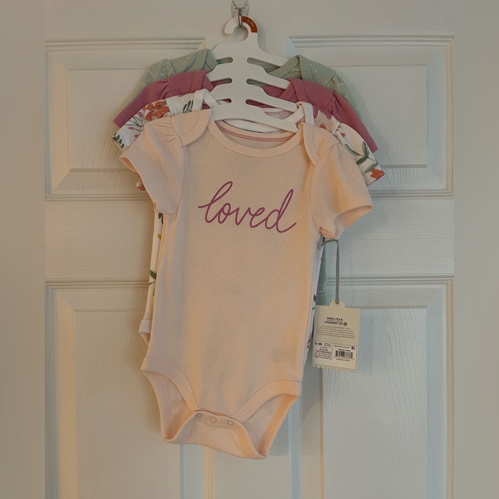 Cloud Island 6-9 month short sleeve onesies 4 pack. New with tags